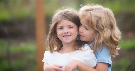 Little Boy And Girl Best Friends Hugging Kids Kissing Each Other With