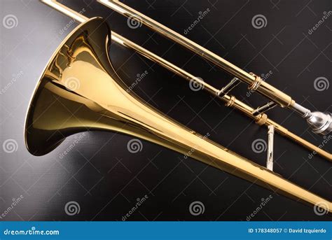 Golden Trombone Detail On A Black Wooden Table Stock Image Image Of