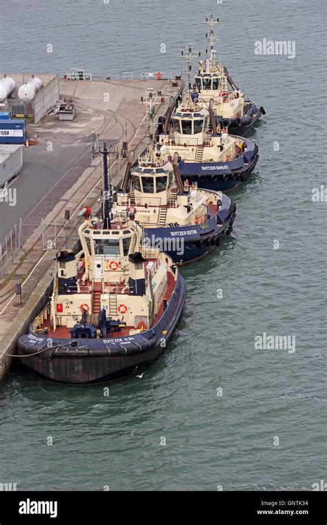 Svitzer Tug Boats Moored In Line At Southampton Docks Stock Photo