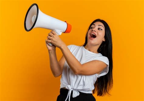 Free Photo Joyful Young Caucasian Girl Holds Loud Speaker Looking At Side