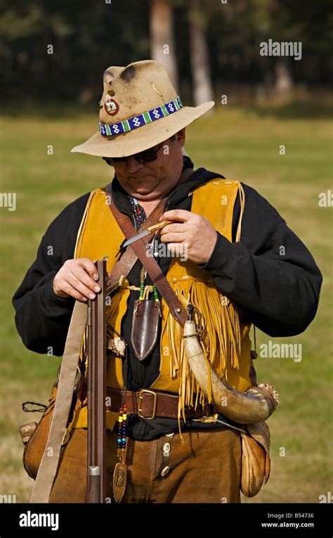 Man wearing trapper costume demonstrating black powder rifle at Steam ...