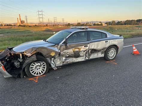 Trooper Falls Over 30 Feet From Elevated Roadway To River Bank While Trying To Escape Crash