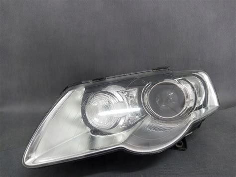 VW PASSAT B6 REFLEKTOR LAMPA LEWA BI XENON SKRĘT 10915056869