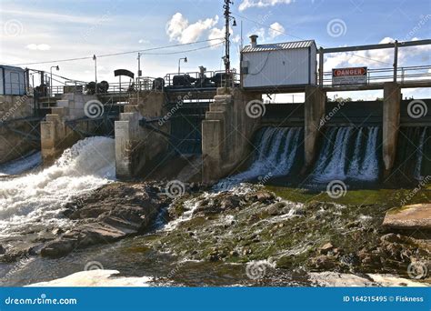 Water Coming Through Spillway Of An Old Concrete Dam Stock Image