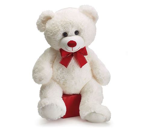 A White Teddy Bear With A Red Ribbon Around Its Neck