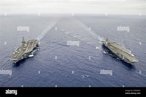 Uss George Washington Left And Uss Ronald Reagan Are Underway Before Conducting A Hull Swap