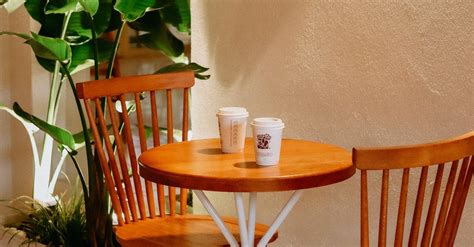 Wooden Table and Chairs in a Bright Cafe · Free Stock Photo