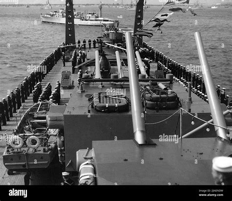 The crew of the U.S. Navy heavy cruiser USS Baltimore (CA-68) manning ...