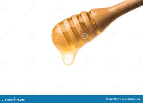 Honey Dripping From A Wooden Honey Dipper Isolated On White Back Stock