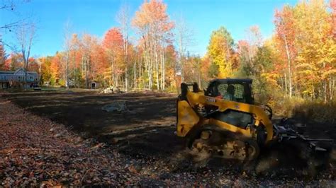 Carving A Swale And Grading The Mine Field Of A Clearing W Cat 259D3