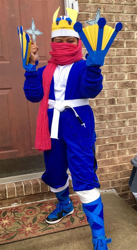 Greninja costume: blue cardigan, blue pants, pink scarf, blue painters tape, martial arts belt ...