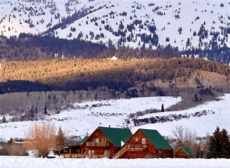 Streak of sunlight illuminating the base of Fred’s Mountain, home of Grand Targhee Ski Resort in ...