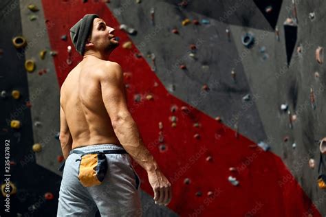 Rear View Of Athletic Male Climber With Naked Muscular Perfect Body