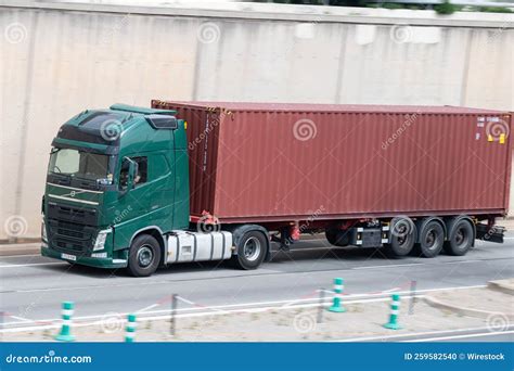 Volvo Fh Truck Loading A Red Container Trailer Along Barcelona S Ronda