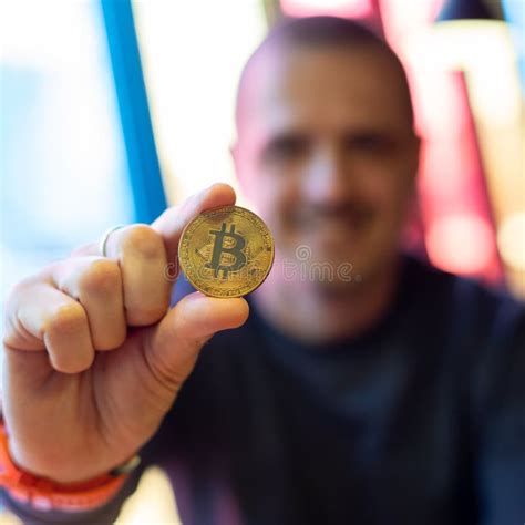 Man Holding Digital Crypto Currency Coin Of Bitcoin Stock Photo Image