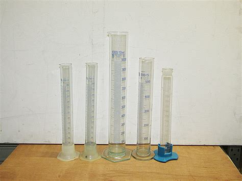 0064151 Tall Graduated Cylinders Glass X 5 Off Stockyard Prop And Backdrop Hire