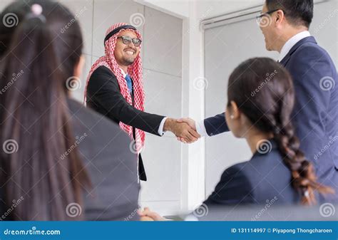 Arabic Businessman Shaking Hand Over A Deal To Partnersuccessful And