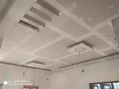 An Unfinished Ceiling In A Room With White Paint