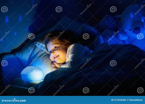 Little Girl Reading a Book in Bed Stock Photo - Image of book, bear ...