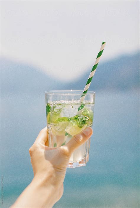 Woman Holding Mojito By Stocksy Contributor Sonya Khegay Stocksy