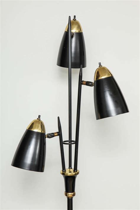 Mid Century Black Lacquered Metal And Brass Three Light Floor Lamp At