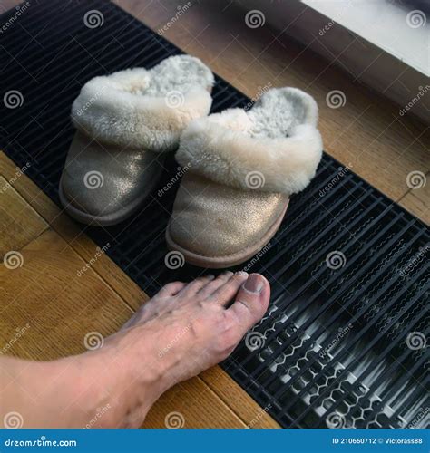 Warming up feet stock photo. Image of floor, grill, leisure - 210660712