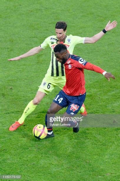 Lille S Jonathan Bamba Fights For The Ball With Angers Vincent Pajot