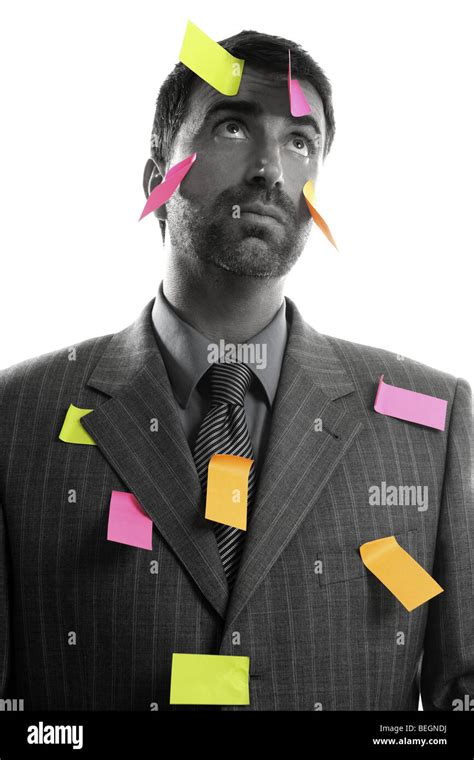 Businessman full of memo stock message notes over white studio ...