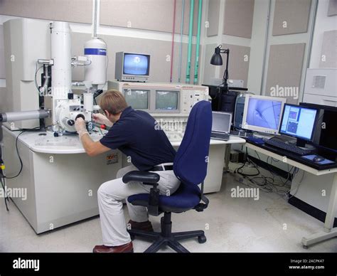 Fe Scanning Electron Microscopy Researcher Operating A Field Emission