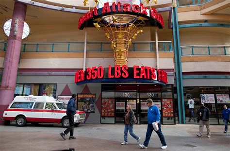 Tourists at Heart Attack Grill Fremont Street react to burgers