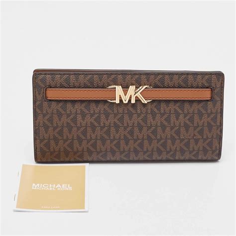 Michael Kors Brown Signature Coated Canvas Reed Wallet For Sale At Stdibs