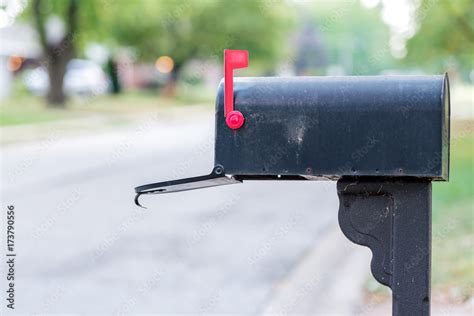 Mailbox with flag up and open Stock Photo | Adobe Stock