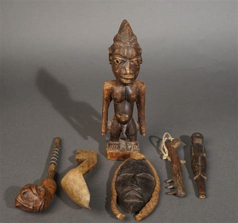 Lot Collection Of African Wood Carvings Including Ibeji Diminutive Mask Pipes Pulleys And