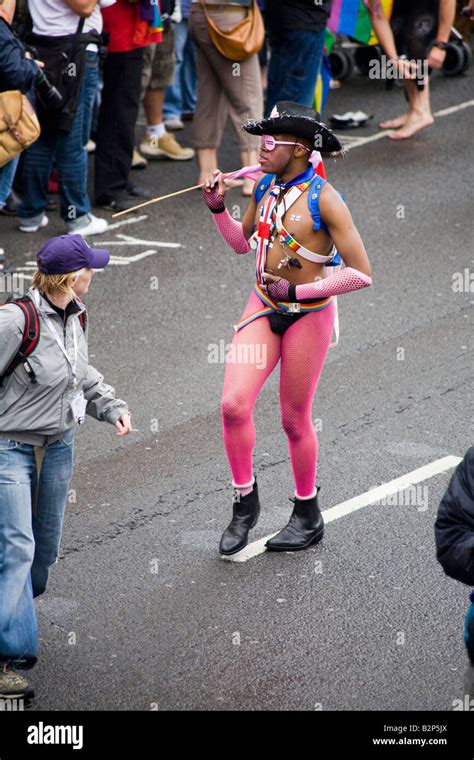 Man Marching And Dancing Along The Road In Brighton S Gay Pride Procession Crowds Line The