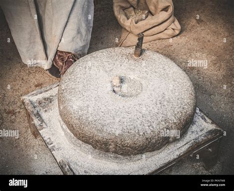 The Ancient Quern Stone Hand Mill With Grain Old Grinding Stones