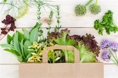 Premium Photo Fresh Herbs In Eco Paper Bag On Wooden Table Food