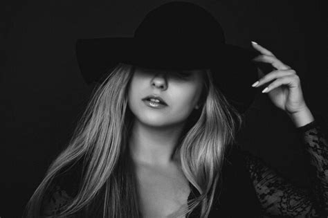Premium Photo Beautiful Blonde Woman Wearing A Hat Artistic Film Portrait In Black And White