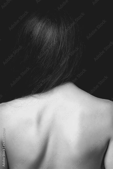 Beautiful Wild Looking Woman With Naked Back Standing In Front Of Camera Model With Long Dark