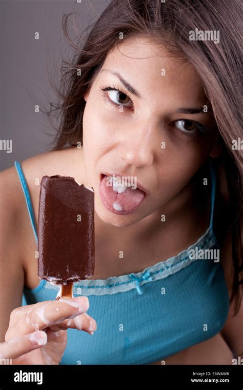Sexy Brunette Woman Eating Chocolate Ice Cream Stock Photo Alamy