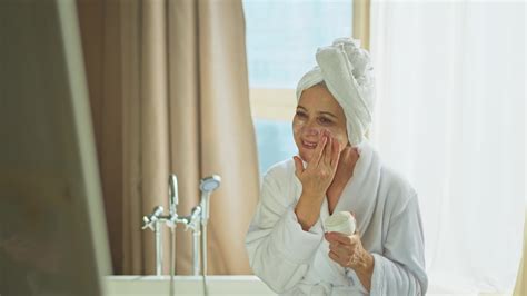Mature Adult Old Woman Applying Nourishing Anti Age Face Cream Doing Daily Beauty Routine