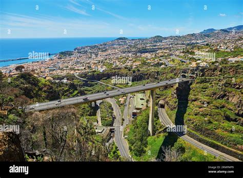 Aerial Scenic View Of Funchal And Large Motorway With Atlantic Ocean