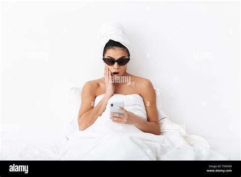 Image Of A Beautiful Surprised Emotional Woman With Towel On Head Lies