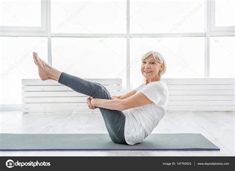 Fit old lady enjoying workout Stock Photo by ©iakovenko123 147760523