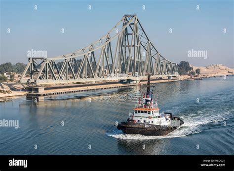 Tug Boat Passes El Ferdan Railway Bridge In The Suez Canal Near