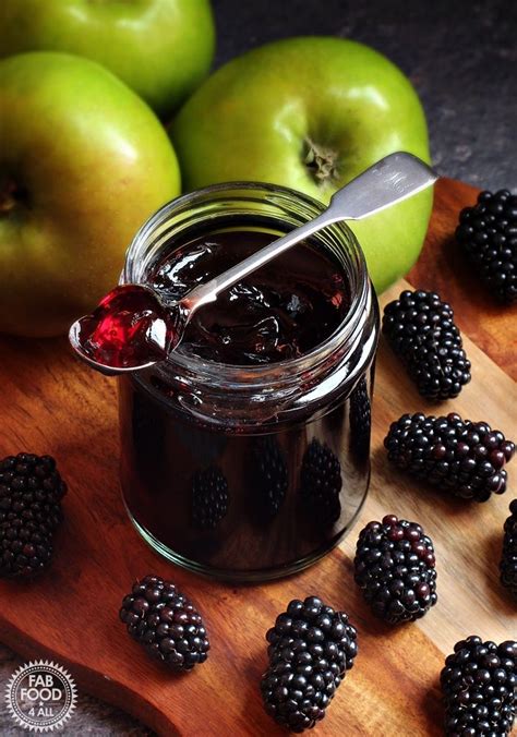 Jar of Easy Blackberry & Apple Jelly on a board with Bramley apples and ...