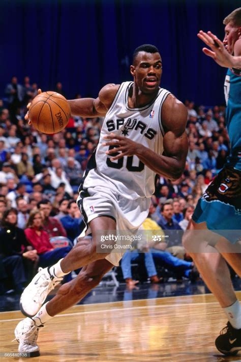 David Robinson of the San Antonio Spurs drives against the Vancouver ...