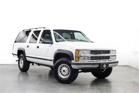 Lifted Square Body Suburban | Vehicle Lift at Ultimate Rides | Ultimate ...