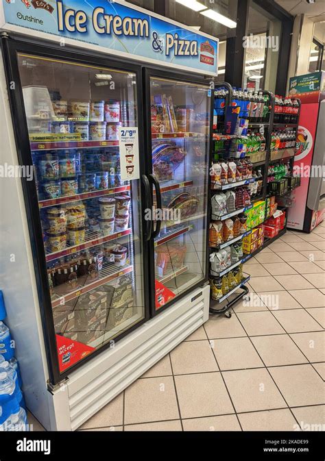 A Vertical Shot Of Ice Cream Cooler At Speedway Gas Station Stock Photo