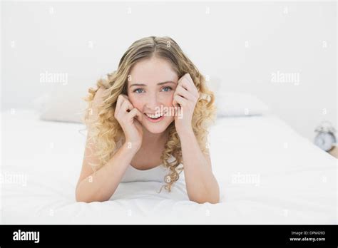 Pretty Lucky Blonde Lying On Bed Looking At Camera Stock Photo Alamy