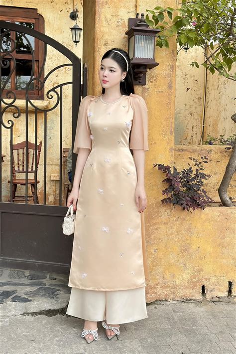Áo dài bưng quả màu nude thêu nơ bé xinh BNU112 NiNiStore 2025